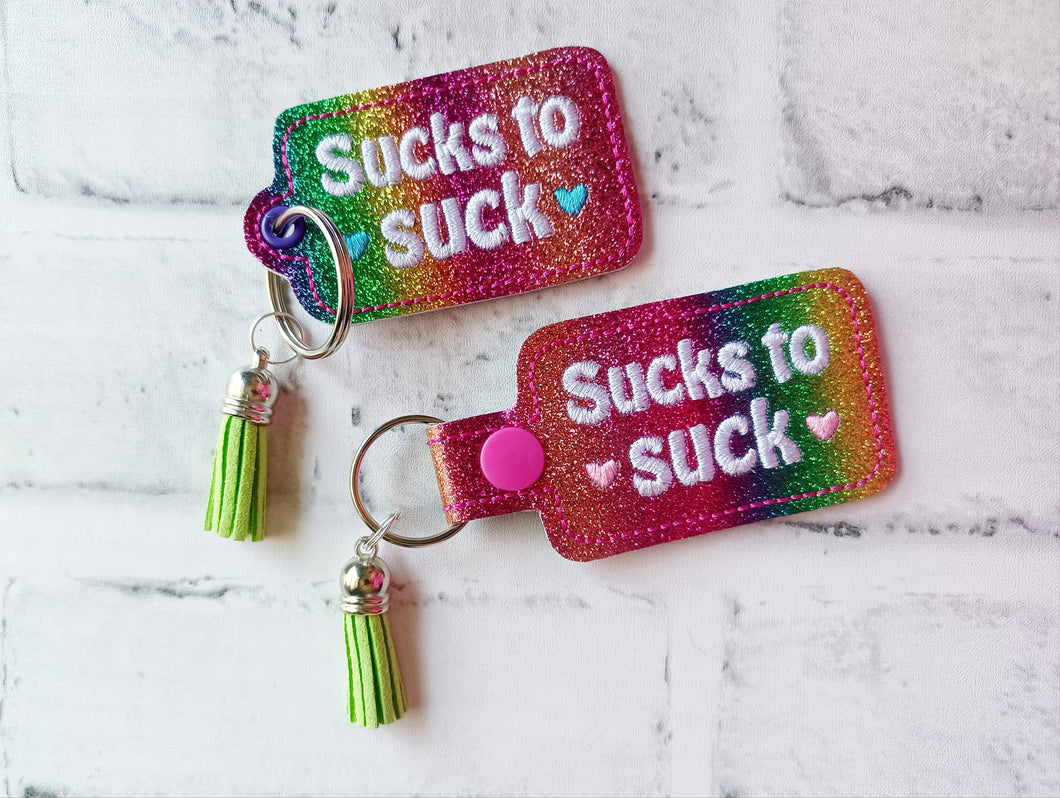 Sucks To Suck snap tab and eyelet fob (single and multi files included) machine embroidery file DIGITAL DOWNLOAD